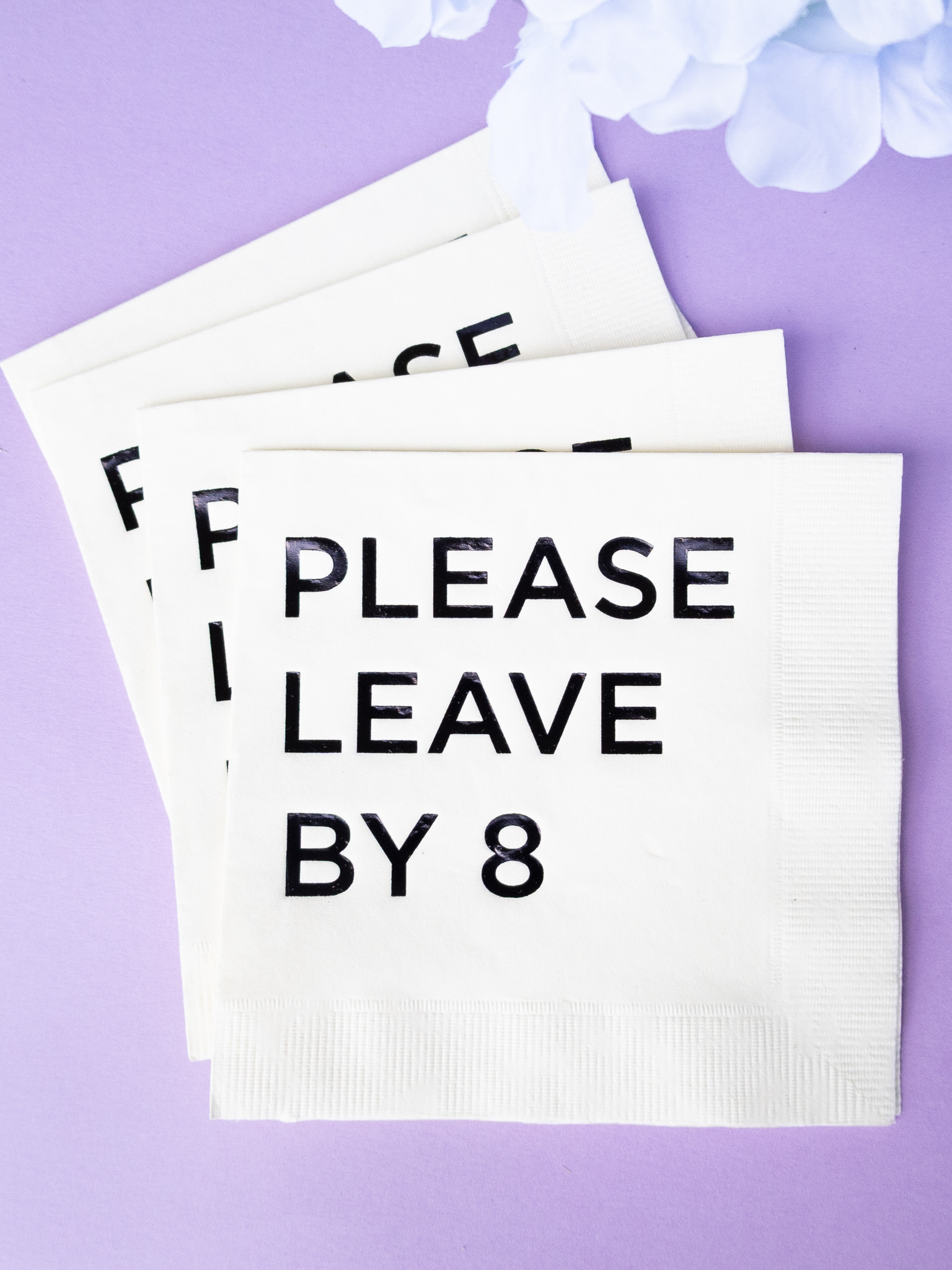 small stack of please leave cocktail napkins